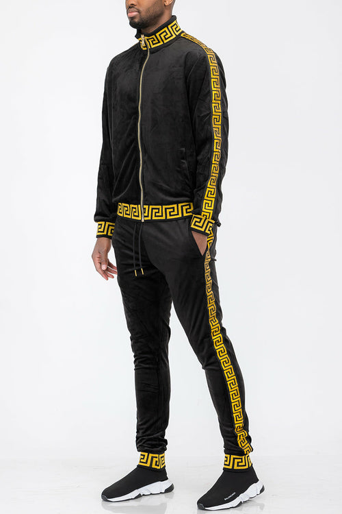 Black tracksuit with yellow patterns on a white background