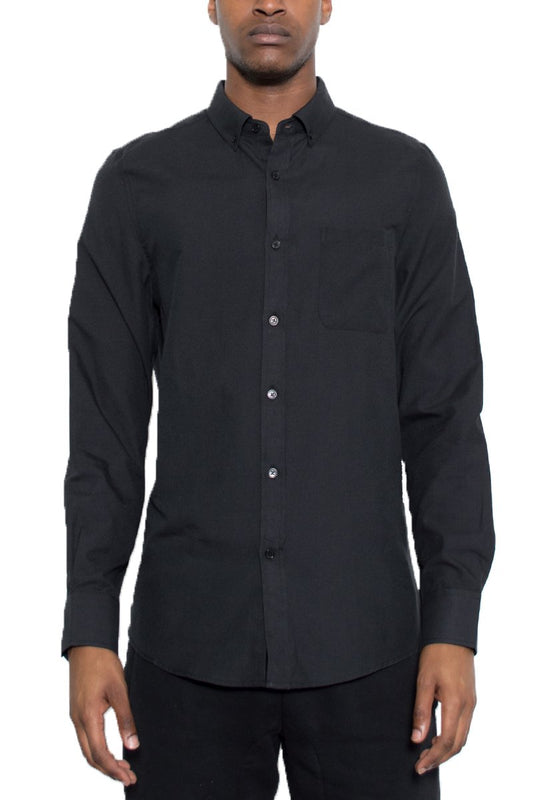 Black button-up shirt worn by a person on a white background