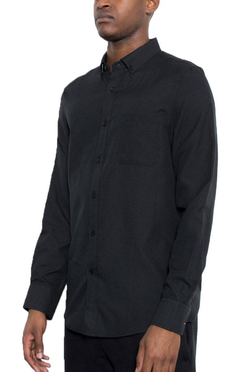 Man wearing a black button-up shirt on a white background